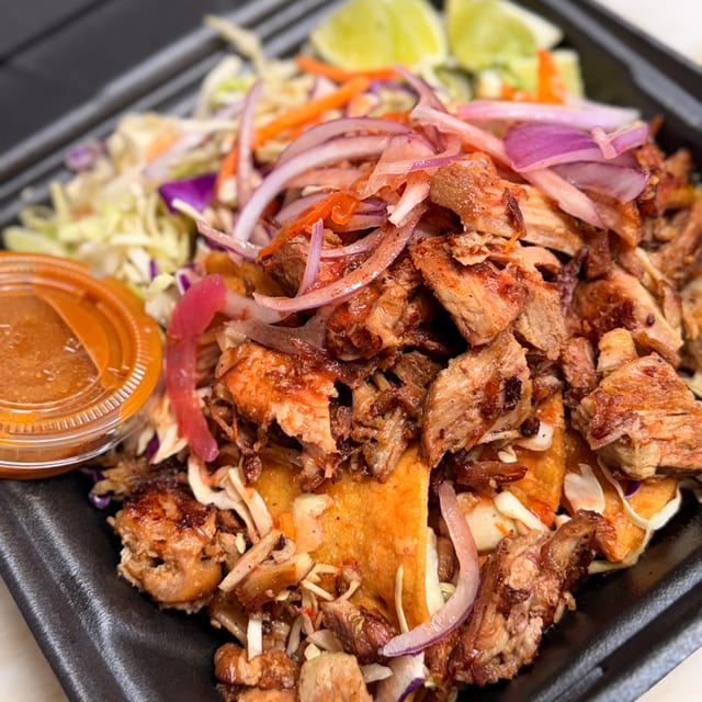 Tacos de papa ahogados w/ carnitas on top.